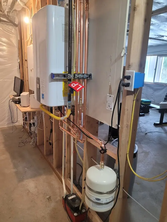 Licensed plumber repairing a kitchen sink in Walden